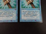 two cards that are sitting on a table