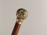 a close up of a cane with a stick handle