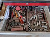 a tool box full of tools sitting on a table