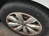 a close up of a tire on the side of a car