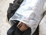 a cardboard box with a pair of shoes inside of it