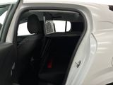 a white car with the door open and the passenger seat down
