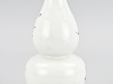 an image of a white vase sitting on top of a table