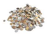 a pile of coins on a white surface