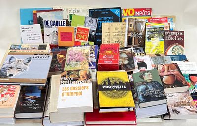 a lot of books that are sitting on a table