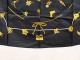 an image of a black and gold scarf with gold embroiderys