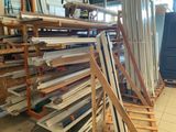 many pieces of wood stacked on a rack in a room