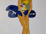 a picture of a woman with a surfboard on the wall