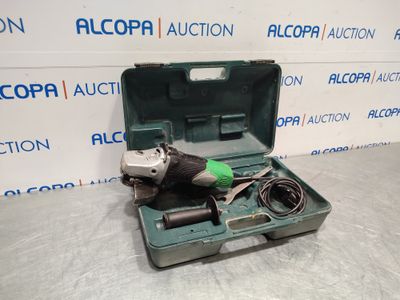 a tool in a green case sitting on top of a table