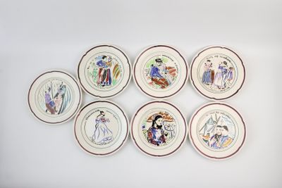 six plates with different designs on them on the wall