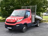 a red truck that is parked in a parking lot