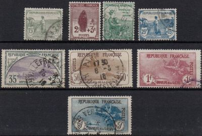 several different types of stamps are on a black surface