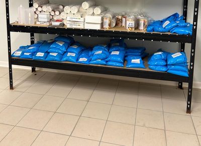 many bags of food on the shelves in the store