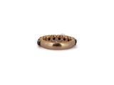 a close up of a gold ring on a white background