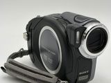 a camera that is sitting on a table with a strap