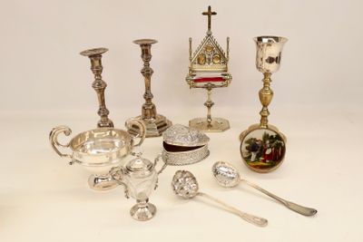 a lot of silver objects on a white table