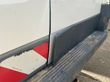 a white van with a red and blue sticker on it