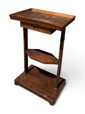 an old wooden table with two shelves on top of it