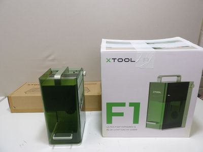 a box with a phone inside of it and a box with a phone inside of it