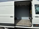 a white van with its doors open in a parking lot