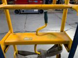 a close up of a yellow safety device on the ground