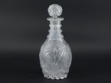an image of a clear glass bottle on a black background