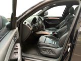 the interior of a car with the door open and the driver ' s seat down