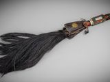 an image of a long black hair brush with a wooden handle