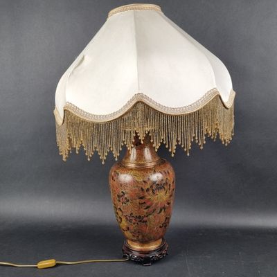 a lamp that is sitting on a table next to a lamp