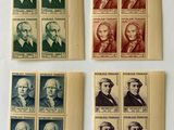 four different stamps with portraits of presidents on them on a white surface