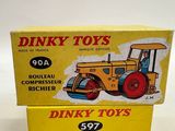 two boxes of dinky toys are stacked on top of each other