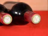 three bottles of wine sitting next to each other on a table