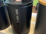 three black canisters sitting on top of a counter