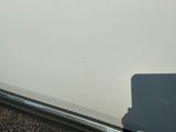 a picture of a white car parked on the side of the road