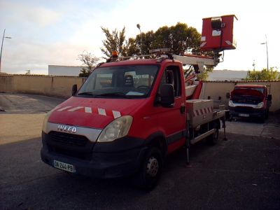 a red truck that is parked in a parking lot