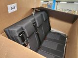a cardboard box with two seats in it and a tag on the side