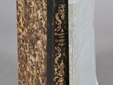 an old book that has been opened to reveal a book