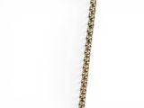 the necklace is gold and has a chain that is attached to it
