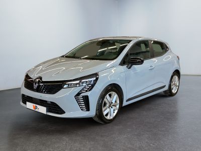 a silver car parked in a room with a black floor