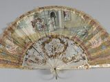 a fan that has a painting on it on it