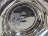 a silver plate that has a sticker on it