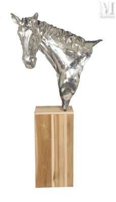 sculpture of a horse head on a wooden base