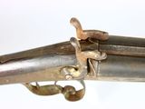 an old gun that is sitting on top of a table
