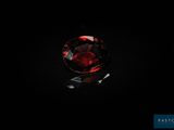 gros plan d'un diamant rouge sur une surface noire