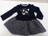 a close up of a dress with polka dots on it