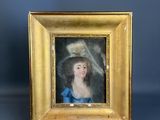 un tableau représentant une femme en robe bleue et coiffée d'un chapeau