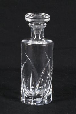 an image of a glass decanter on a black background