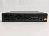 an image of a small black computer with a hard drive on top of it