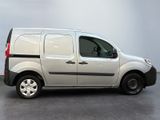 the van is parked on the concrete floor in the room