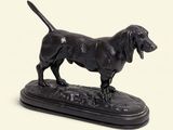 a statue of a dog that is standing on a base